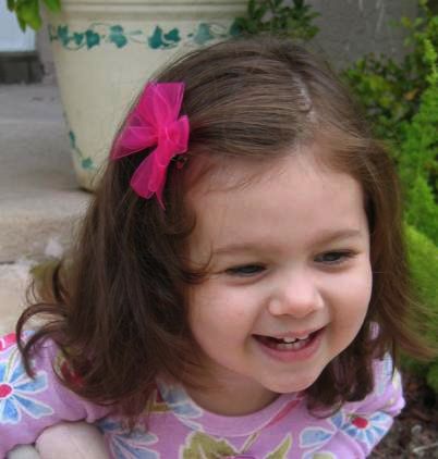 Ava models our medium sheer hair bows