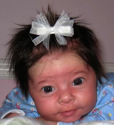 Charlotte models our infant / toddler sheer hairbow